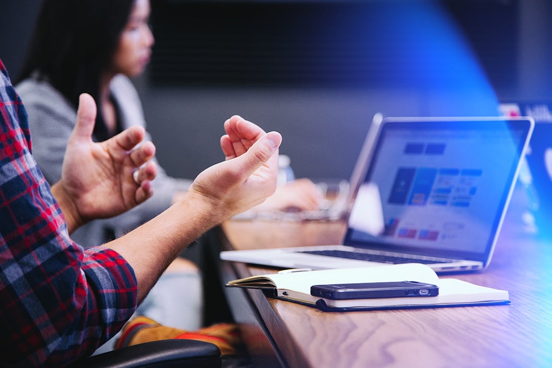 Man gesturing in meeting 